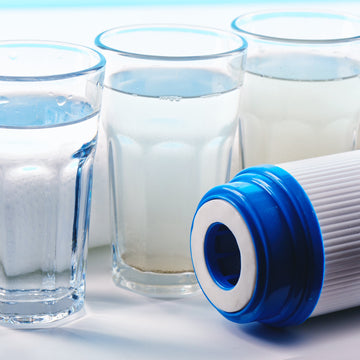 Water filters next to glasses of water